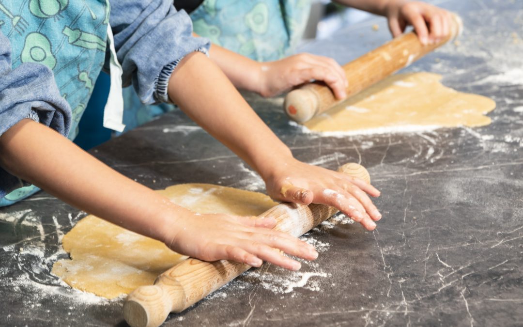kids hands making dough